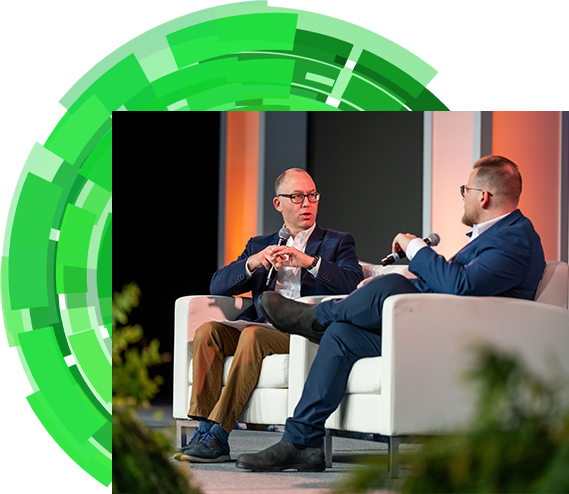 Two men on stage having conversation