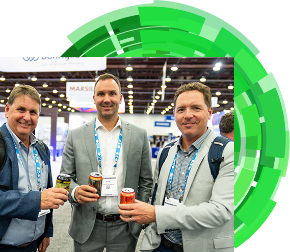  Three men dressed in suits are seen holding drinks at an event, capturing a moment of networking and conversation