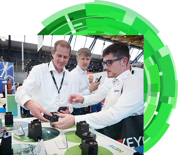 An exhibitor explaining his product to an attendee